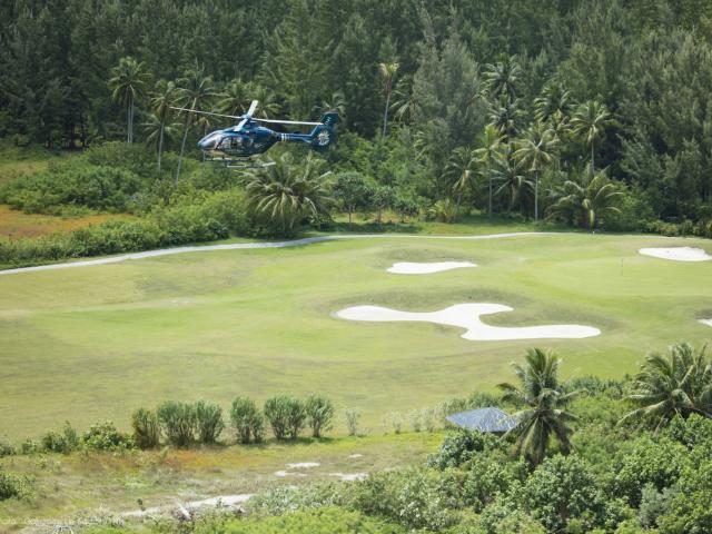 Helicopter flying over Moorea Golf Club