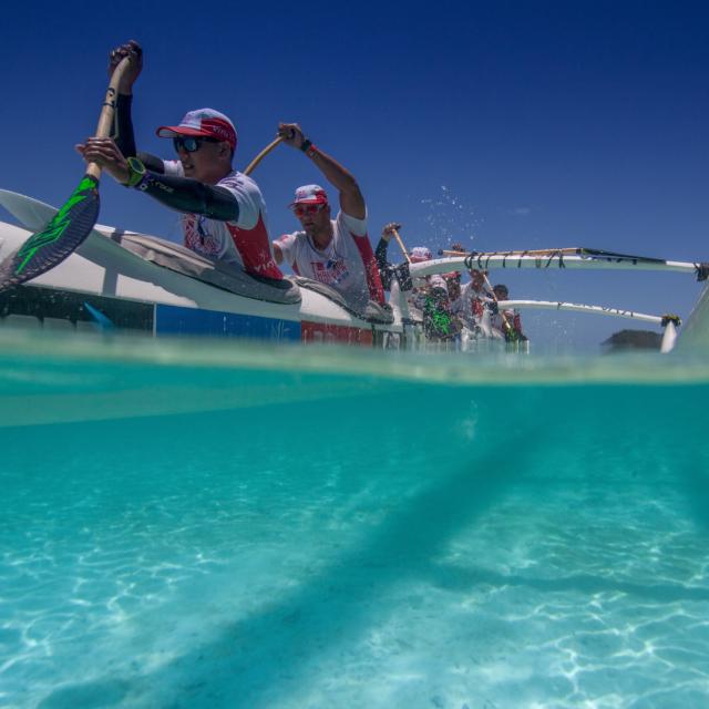 Hawaiki Nui Va’a race in the blue lagoon of Matira, Bora Bora