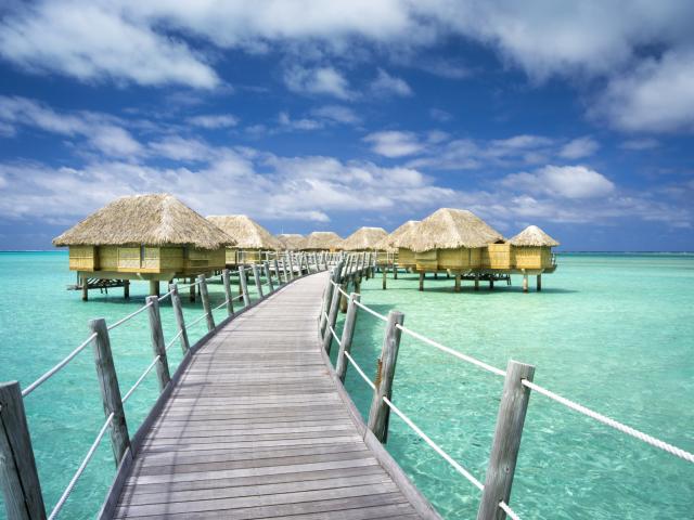 Pier and overwater bungalows of the hotel Le Taha'a