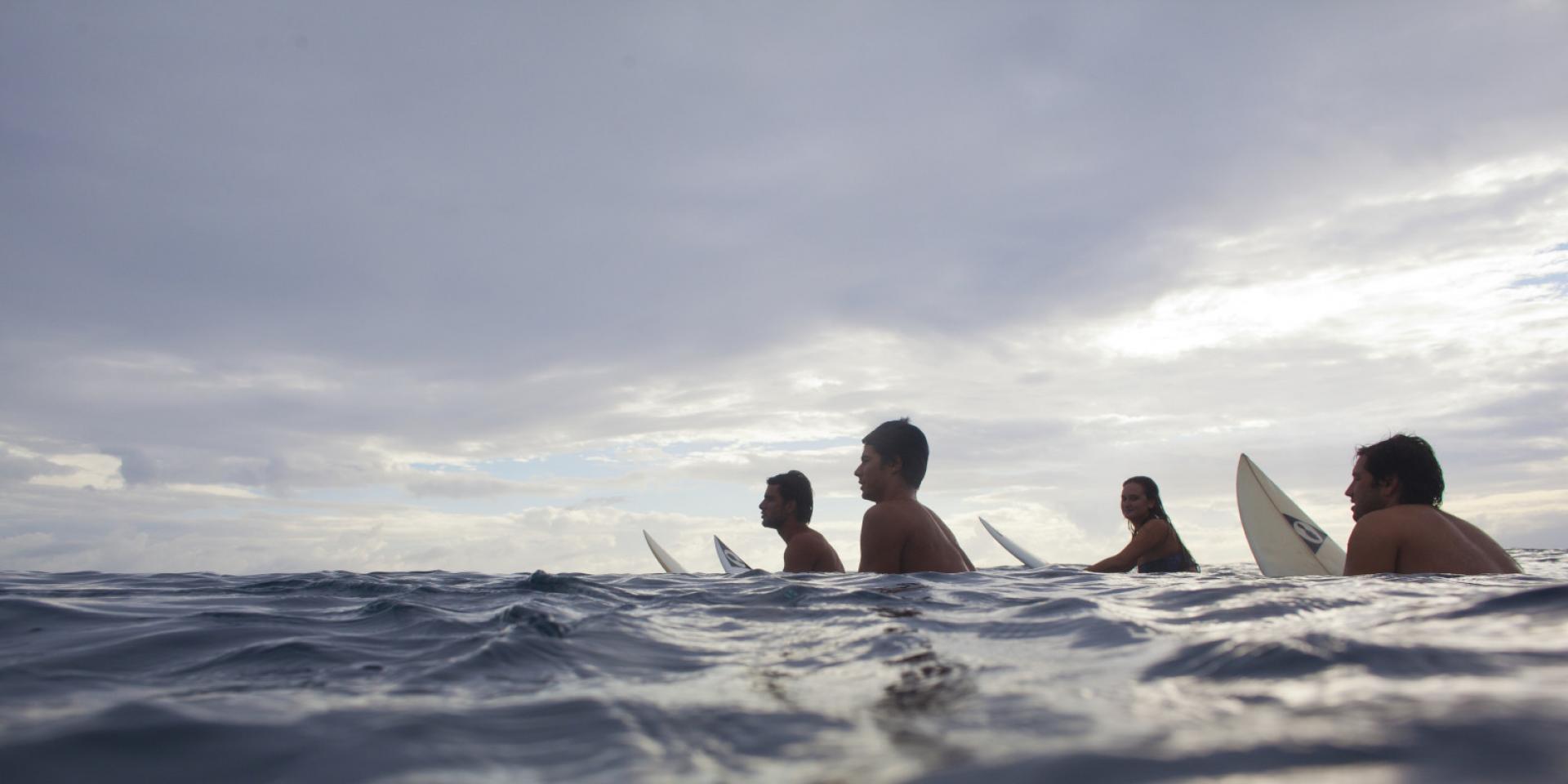 Surfers in Moorea