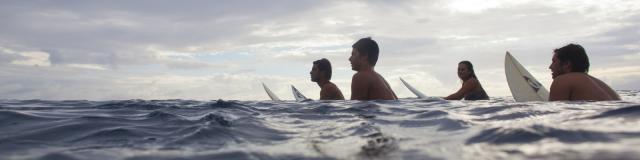 Surfers in Moorea