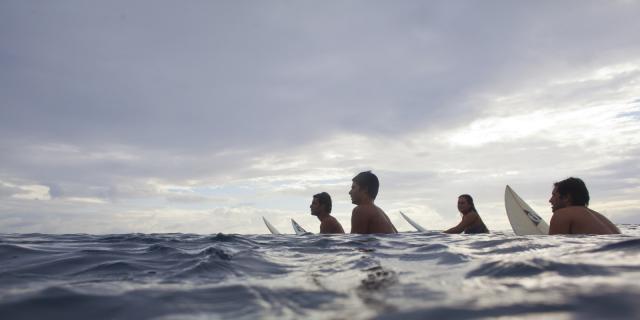 Surfers in Moorea