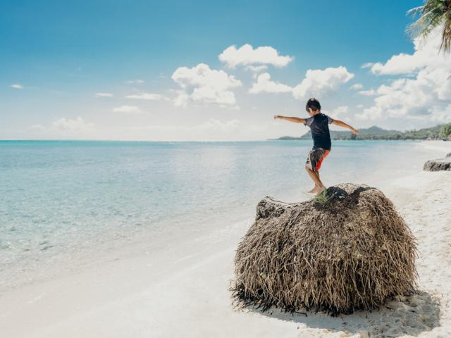 Child playing on Matira beach, Bora Bora