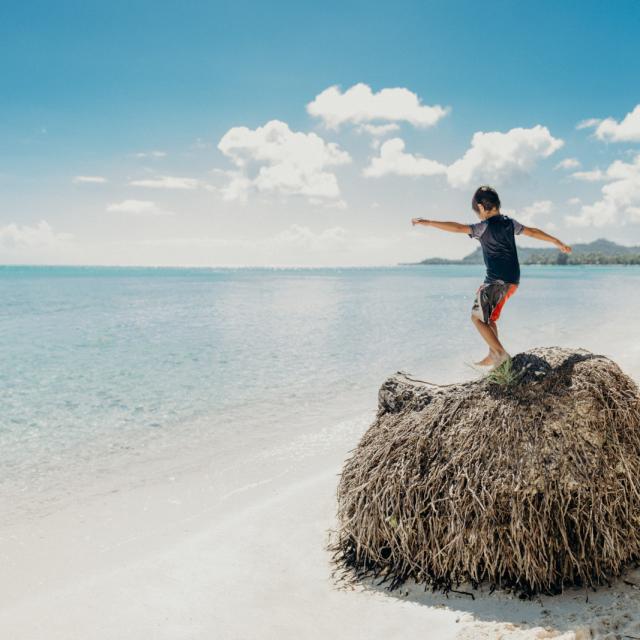 Child playing on Matira beach, Bora Bora